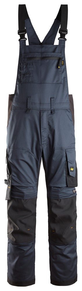 Snickers Workwear - 6051 Pantalones elásticos con peto y tirantes AllroundWork azul marino - negro - Ferrotecnia