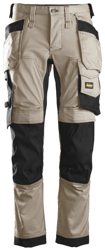 Snickers Workwear - 6241 Pantalones largos de trabajo elásticos AllroundWork Slim Fit con bolsillos flotantes color beige/ negro - Ferrotecnia